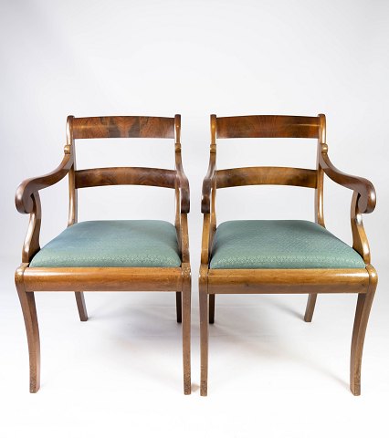 A pair of armchairs in mahogany and upholstered with dark fabric, both are in 
great vintage condition from the 1890s. 
5000m2 showroom.