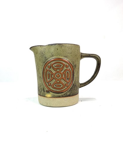 Ceramic jug in brown colours with pattern, from around the 1960s. 
5000m2 showroom.
Great condition
